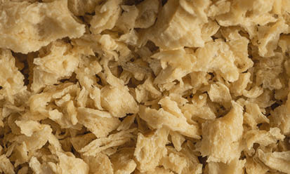 The cream-coloured Trigovit® Tex Granules LCF 130 are textured wheat proteins for use in animal feed | Crespel & Deiters